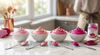 Natural pink buttercream frosting color gradient spectrum from baby pink to electric fuchsia using CHAVI pitaya powder measurement guide